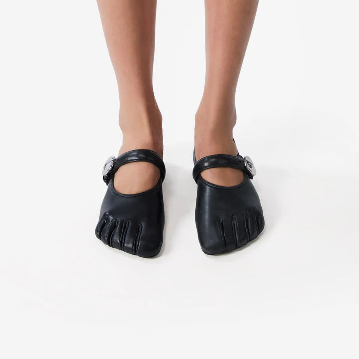 Sculpted foot-shaped flats in soft black leather
